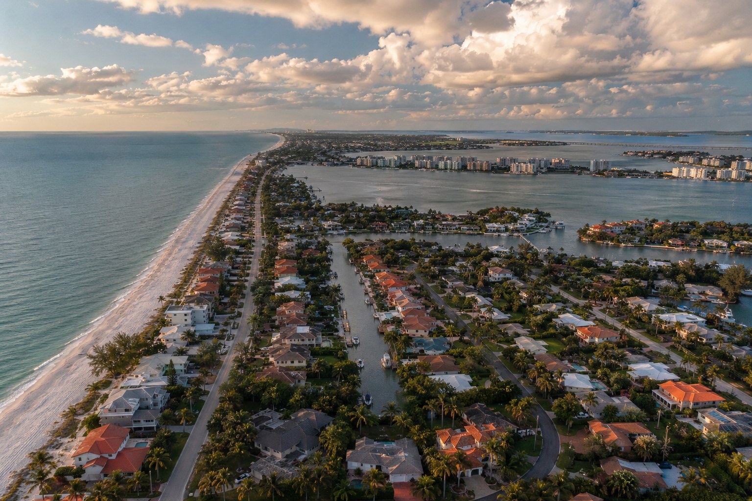 Aerial view of Sarasota barrier islands showing coastal neighborhoods between the Gulf of Mexico and bay